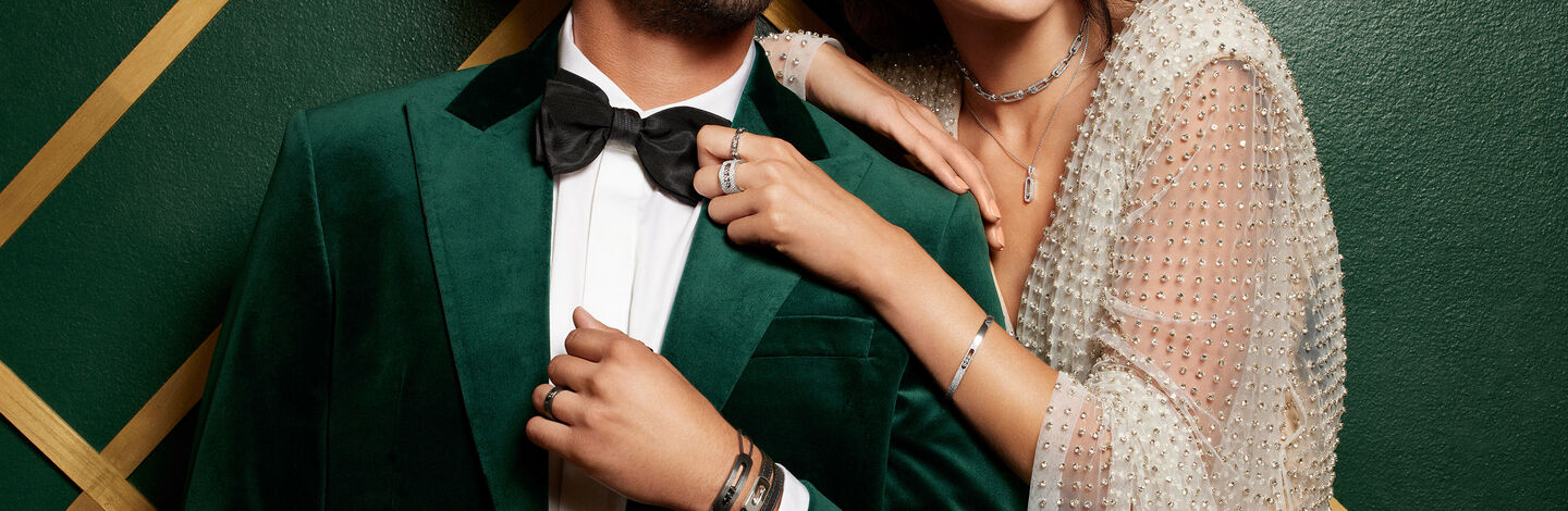 A man and woman dressed for the holiday season in Messika jewellery.