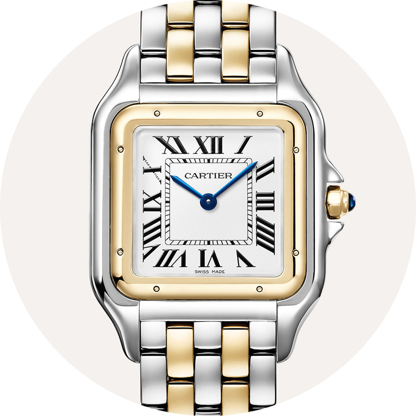 Cartier watch on a grey background.