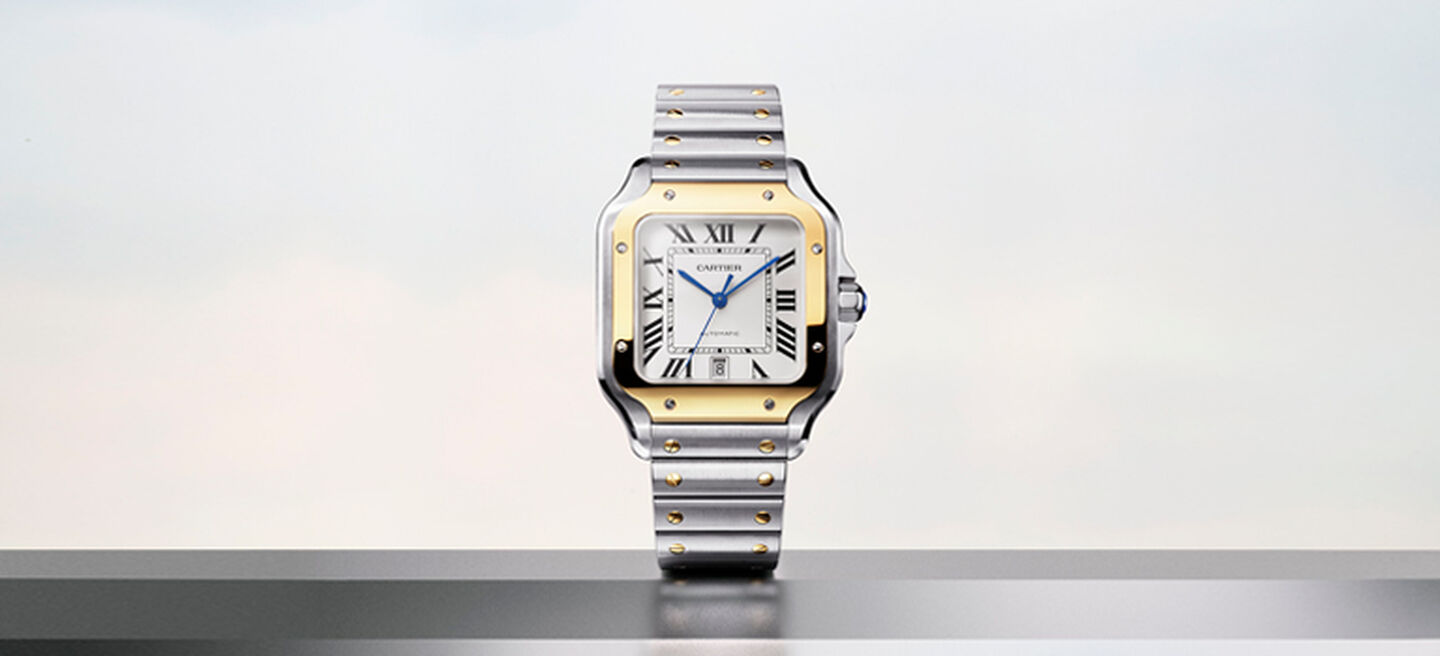 Cartier watch with a gold bezel and steel band