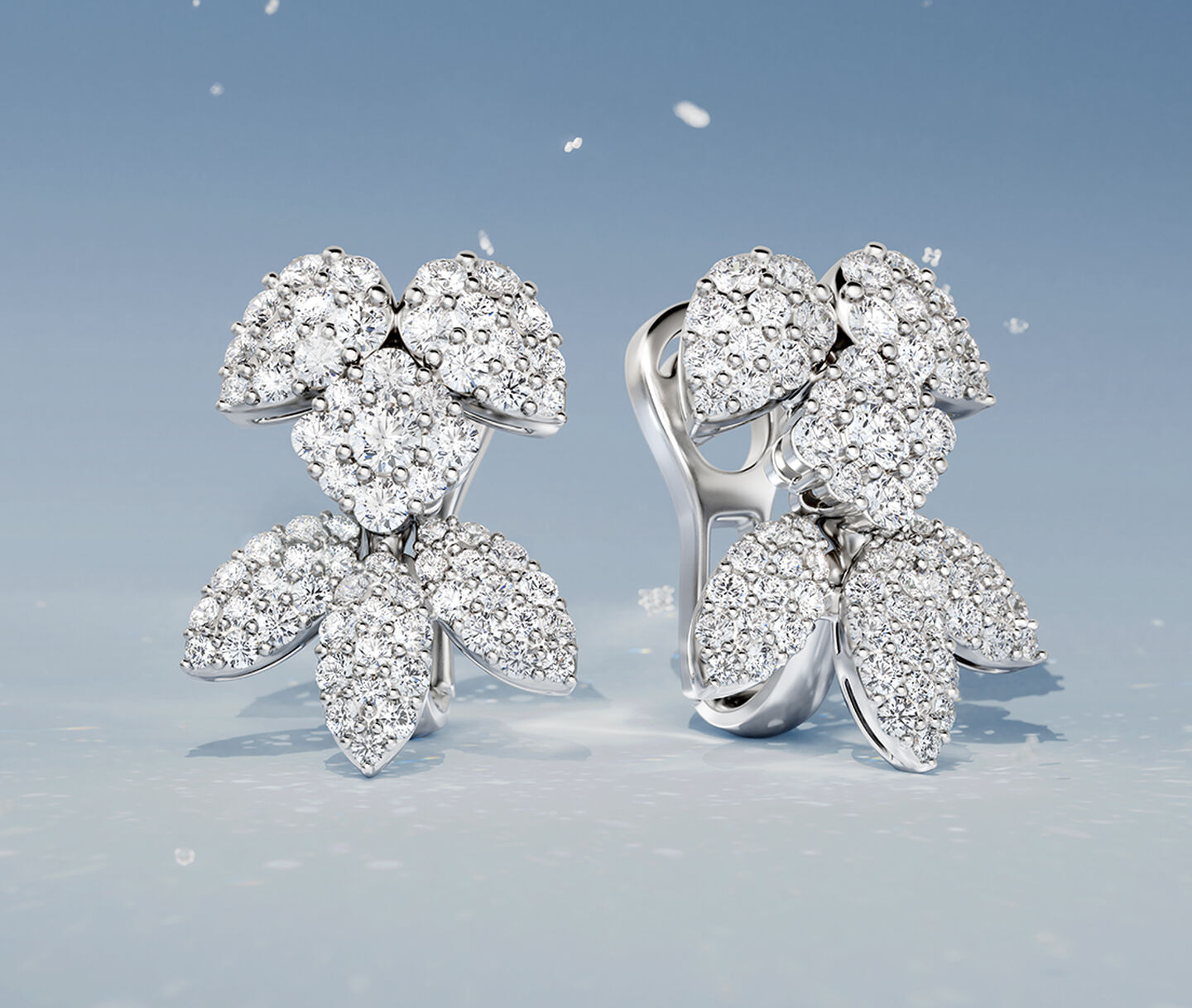 Birks Snowflake snow angel diamond earrings on a blue snow background.