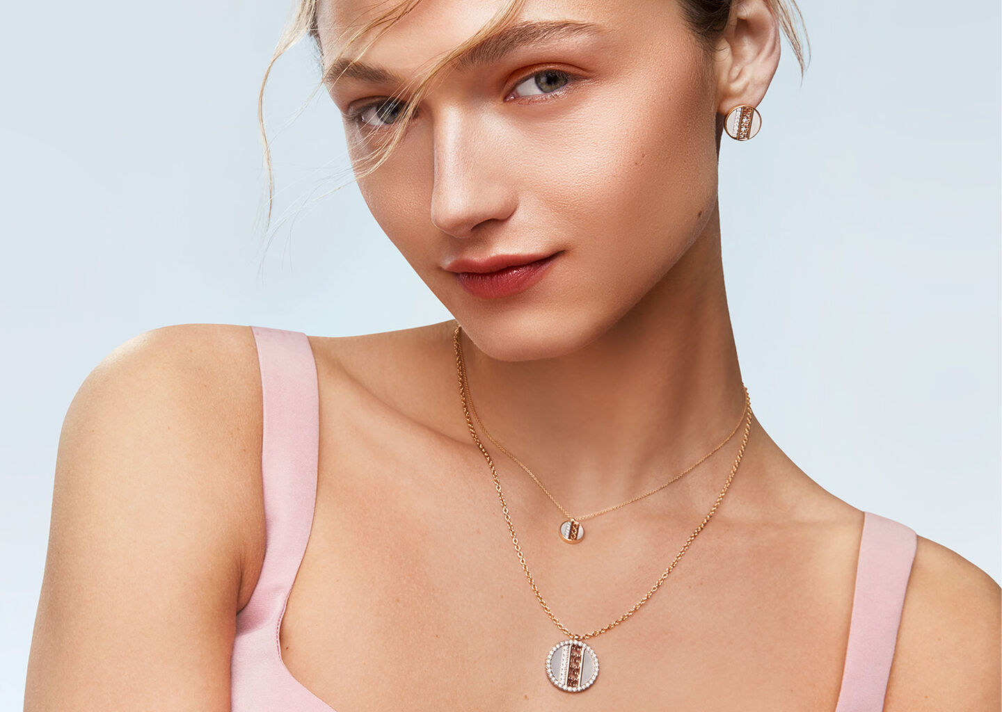 A woman wearing Birks Dare to Dream mother-of-pearl jewellery.