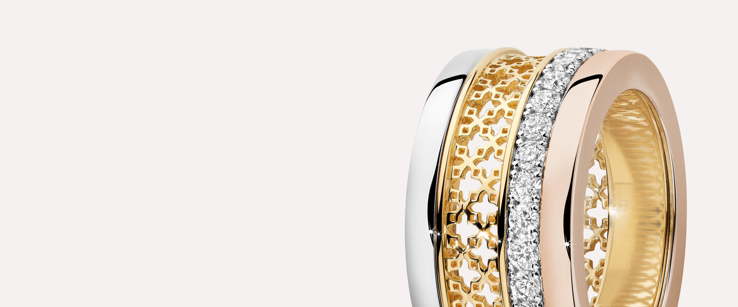 A Birks Dare to Dream ring on a greyish beige background.