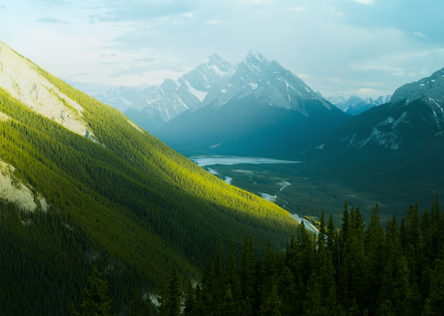 Green snow covered rocky mountains 