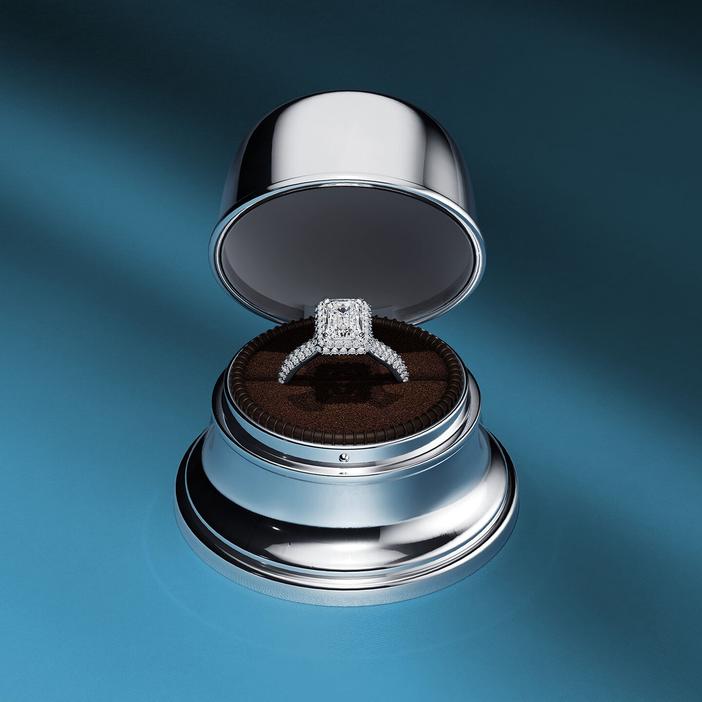 Three Birks diamond engagement rings on a blue background.