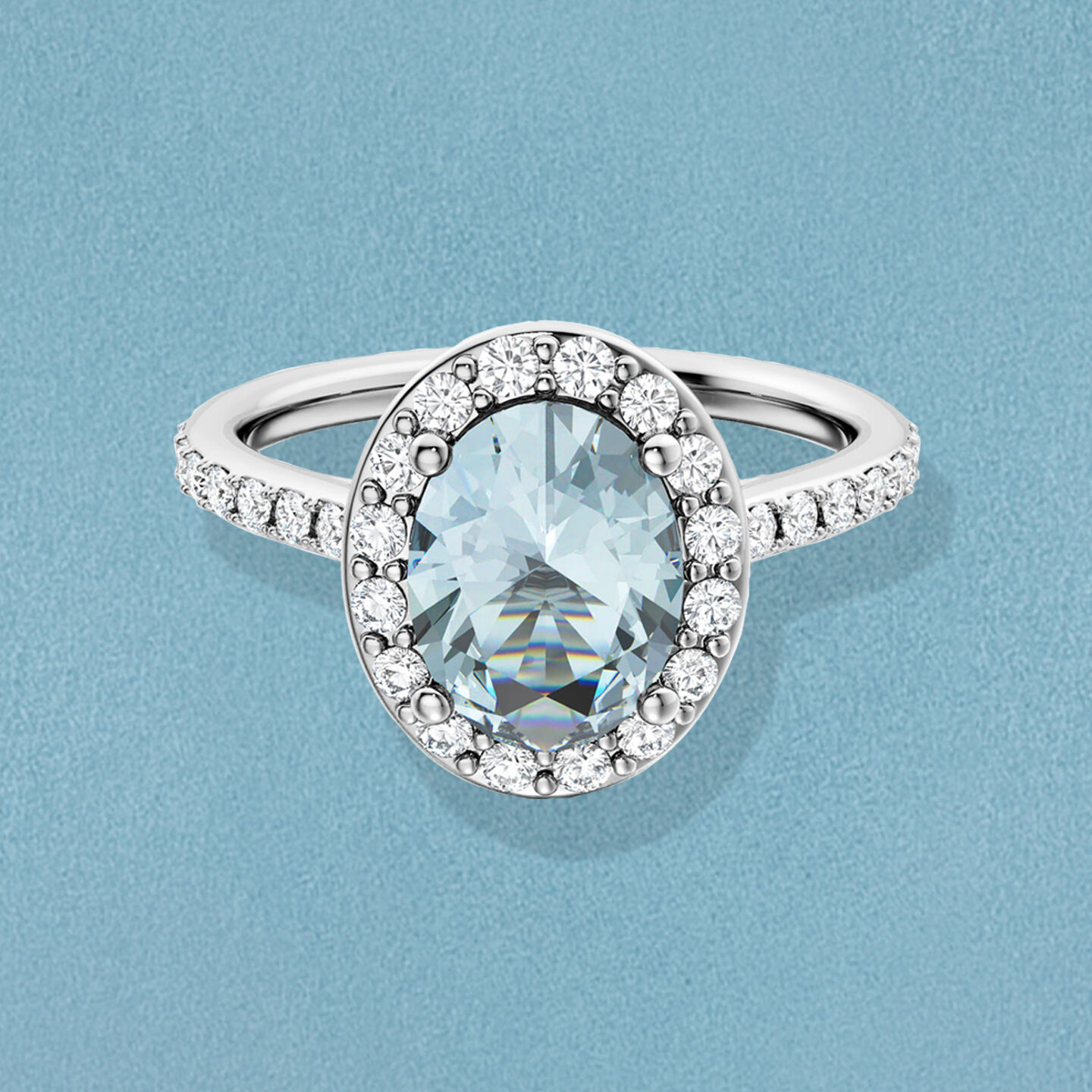 Bague de fian&ccedil;ailles Birks Rosee du Matin orn&eacute;e d'aigue-marine sur un fond bleu.