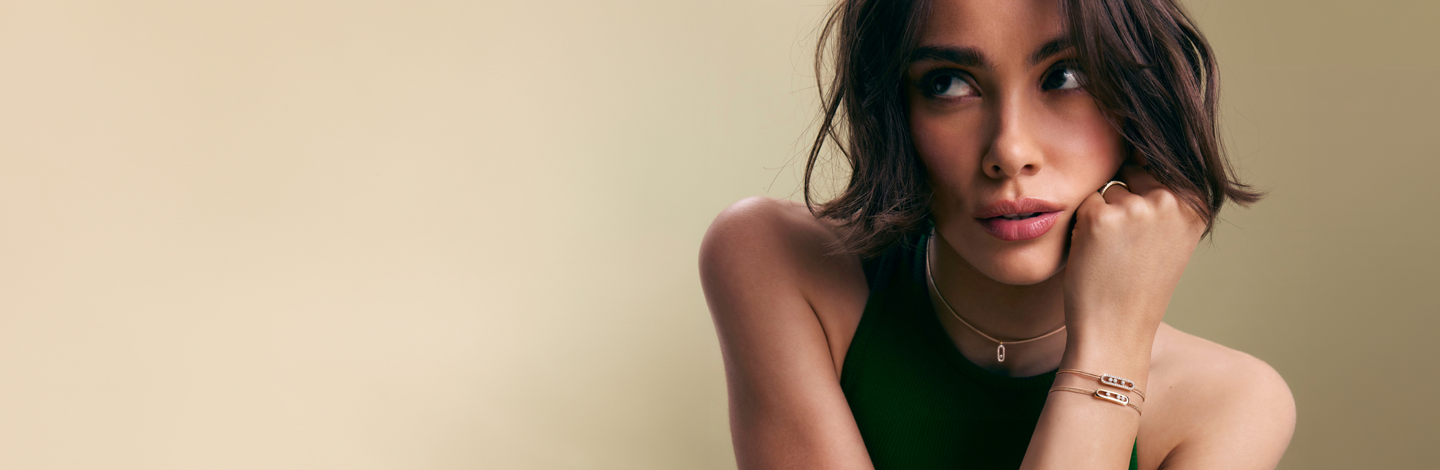 A model wearing Messika Care(s) jewellery.