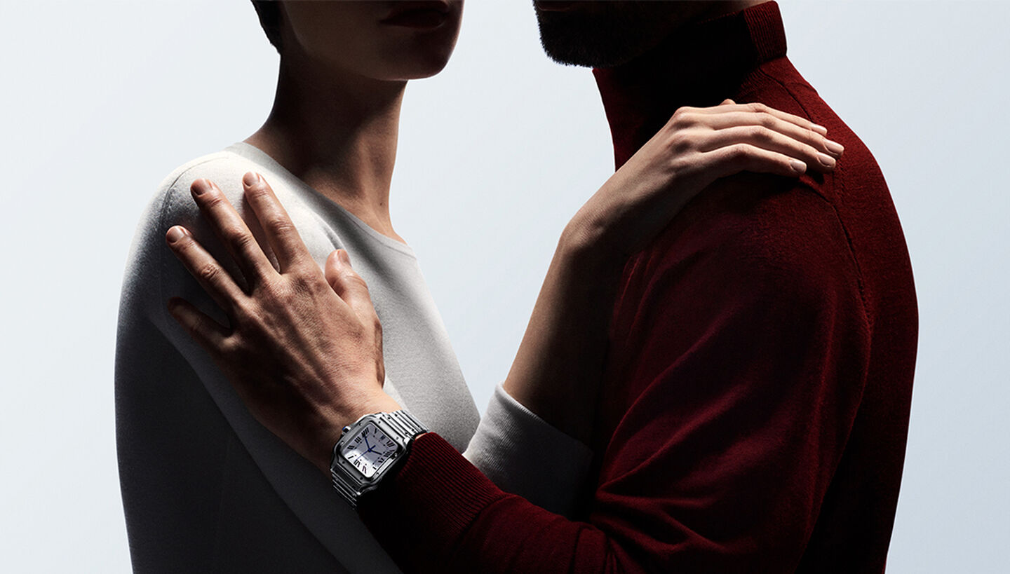 Two people wearing Cartier watches.
