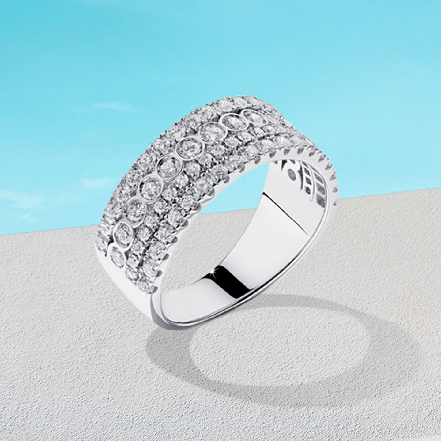 Birks Splash diamond ring on a blue background.