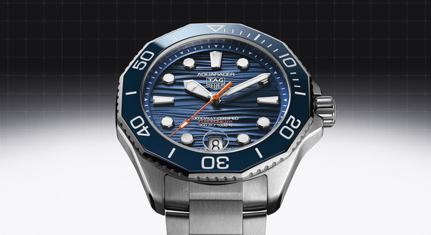 TAG Heuer Aquaracer watch on a black and white background.