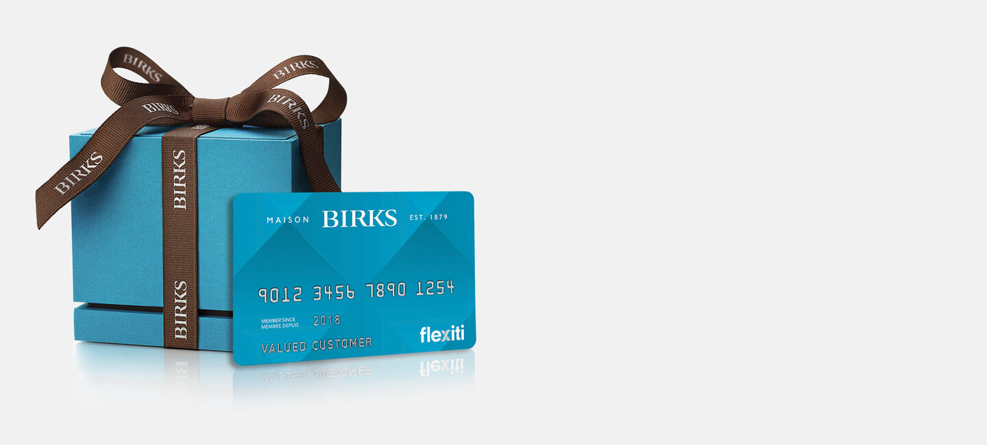 Maison Birks blue box and FlexitiCard on a grey background.
