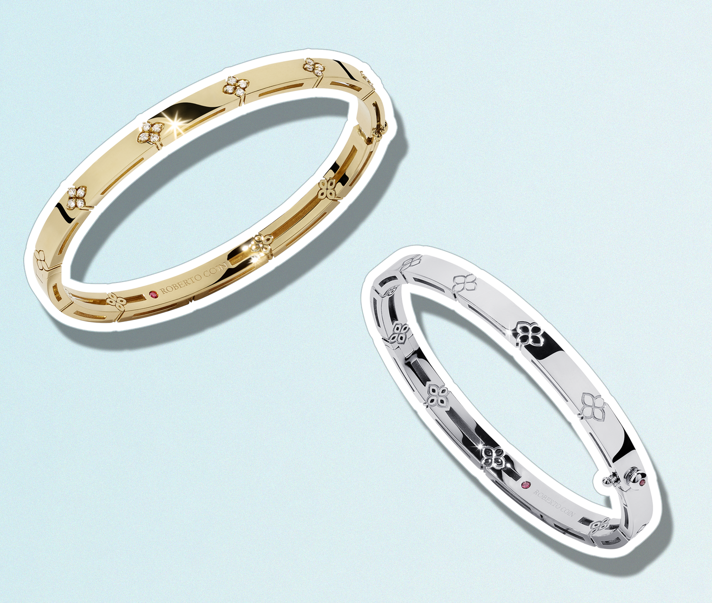 Yellow and white gold bracelets on a light blue background.