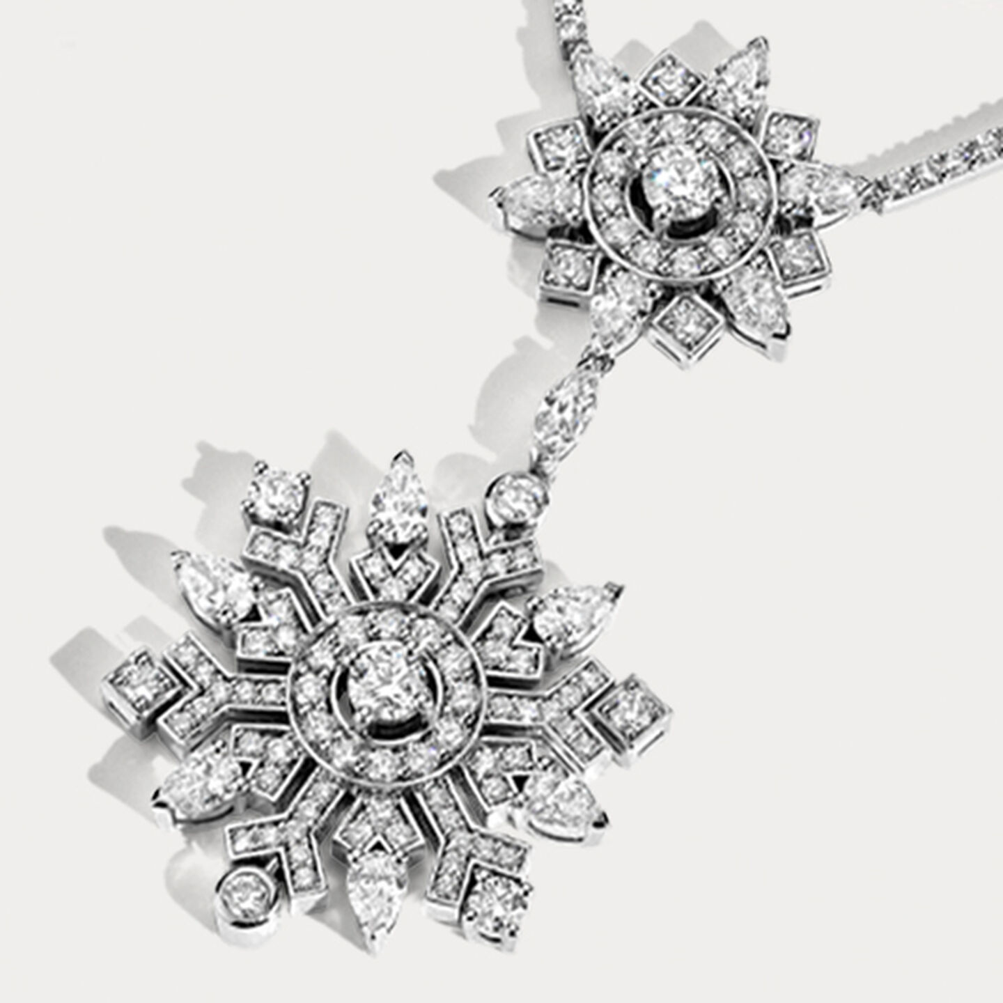 Birks Snowflake High Jewellery Necklace on a beige background.
