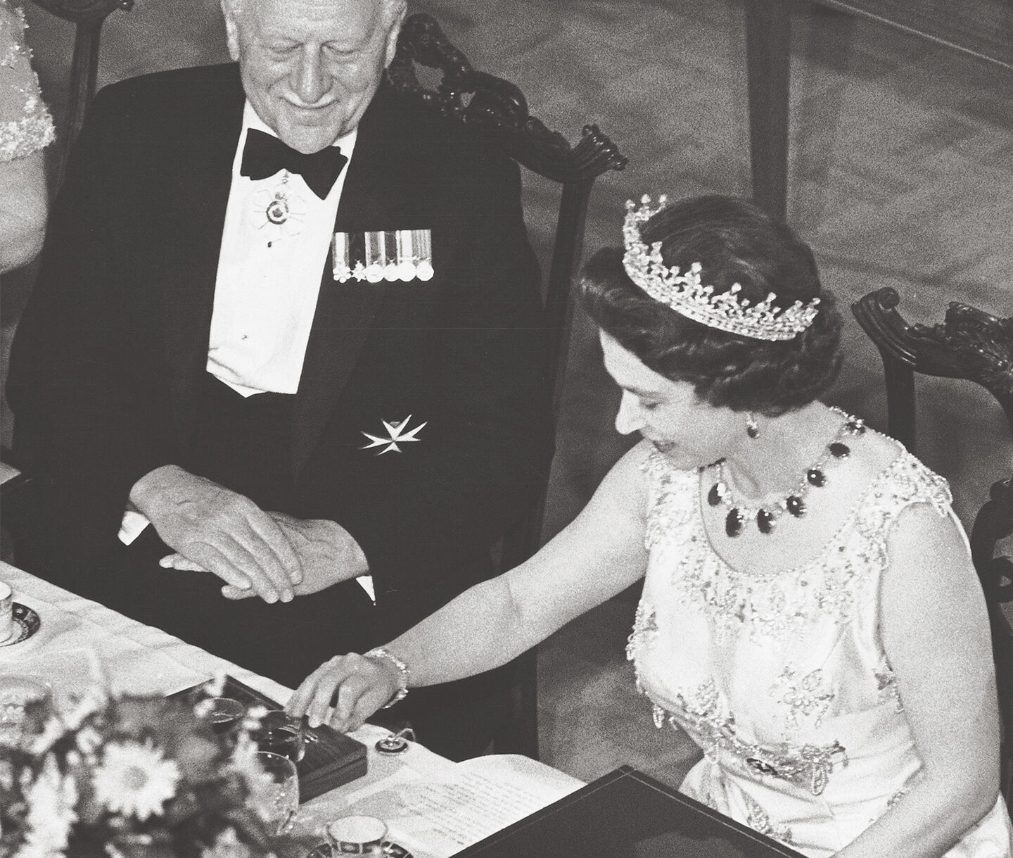 Photo of Queen Elizabeth receiving a gift from Birks.