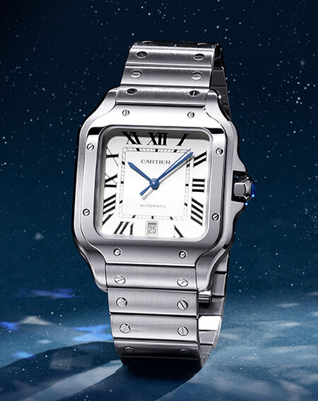 Cartier watch on a man's wrist with a blue suit.