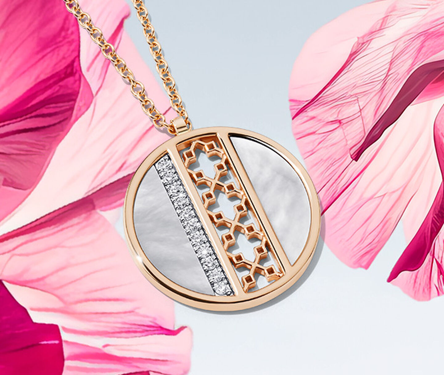 A Birks Dare to Dream mother-of-pearl diamond medallion on a pink flower over a light sky blue background.
