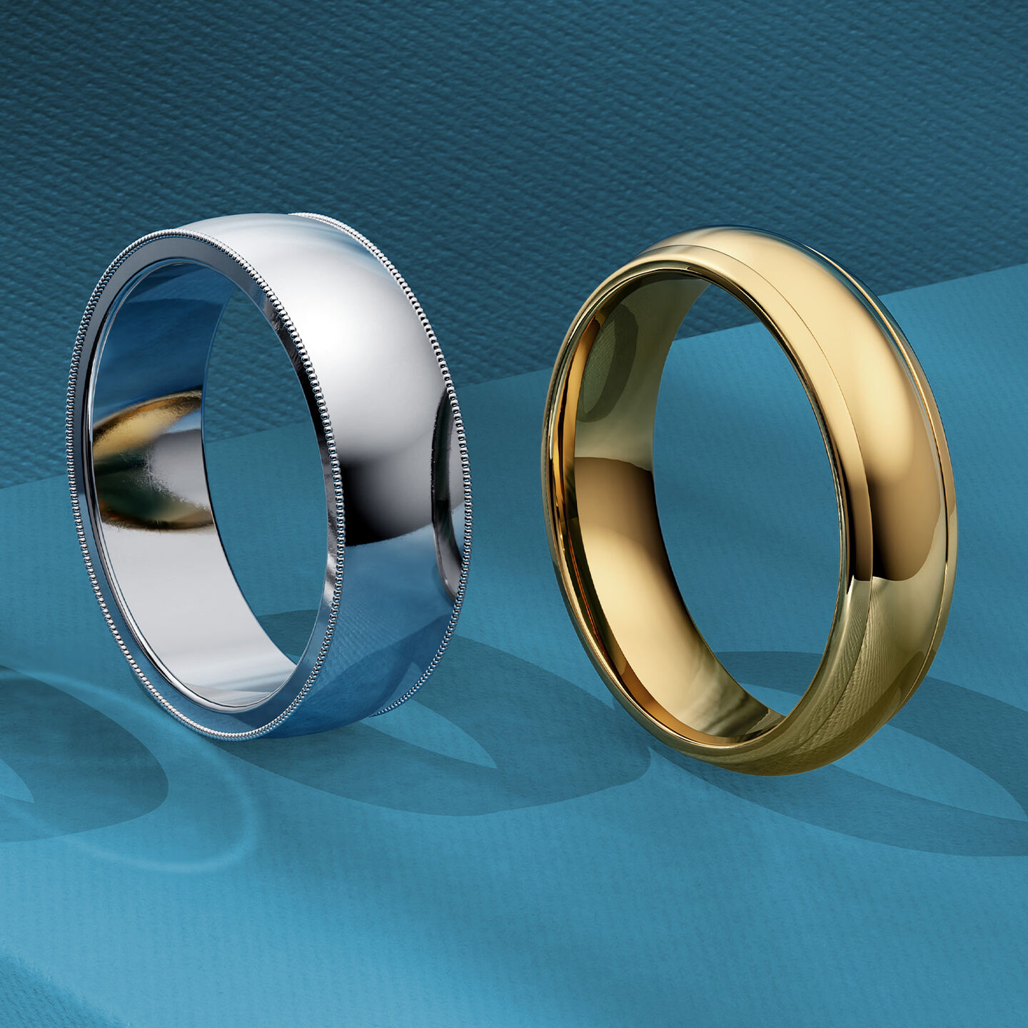 Two Birks men's wedding bands on a blue background.