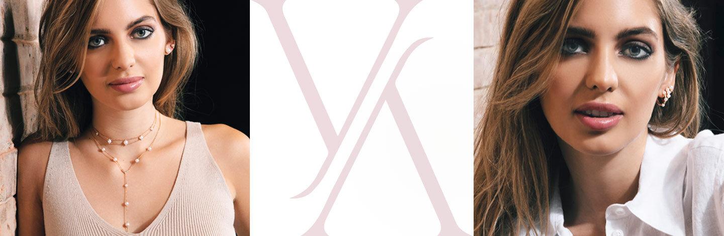 Woman smiling while wearing a Yoko London pearl necklace and earrings