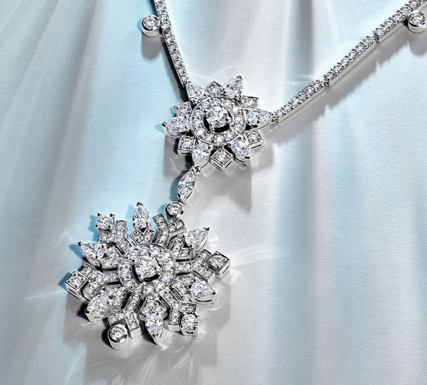 White gold and diamond snowflake pendant.