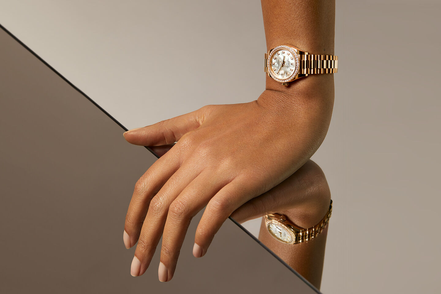 Model wearing a gold and pearl Lady-Datejust