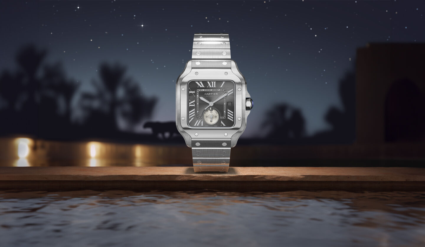 Santos de Cartier watch on a dark background.