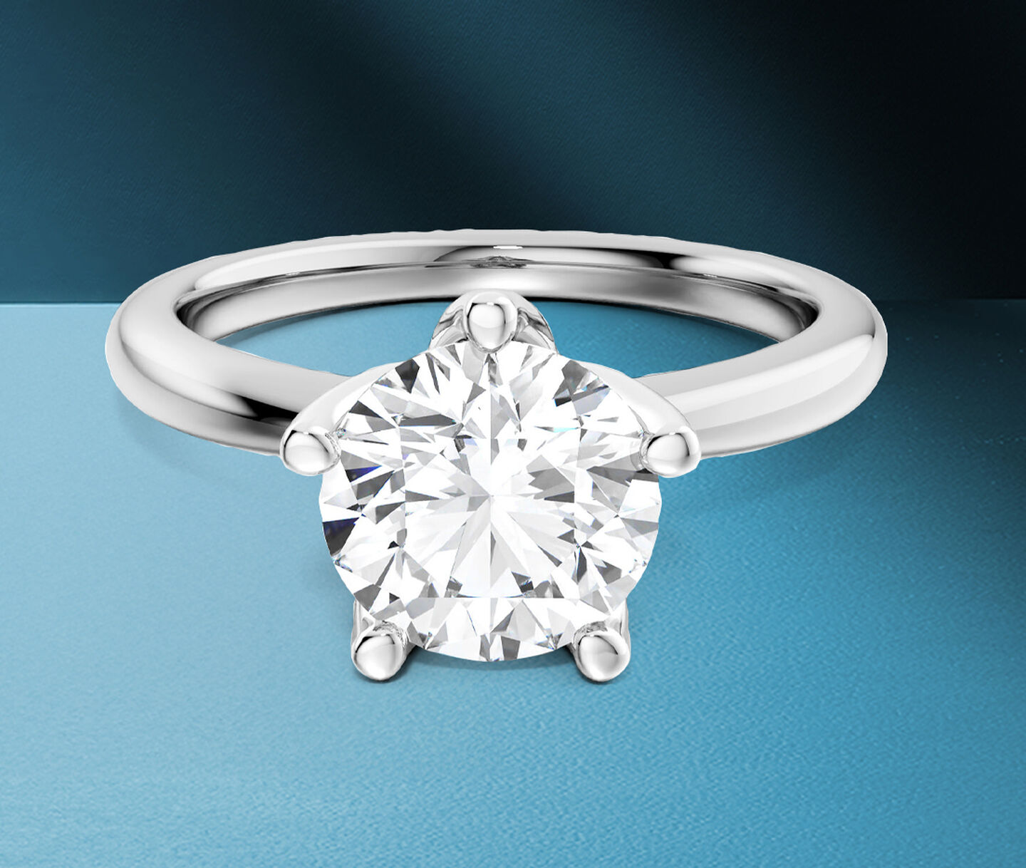 Birks North Star diamond engagement ring on a blue background.