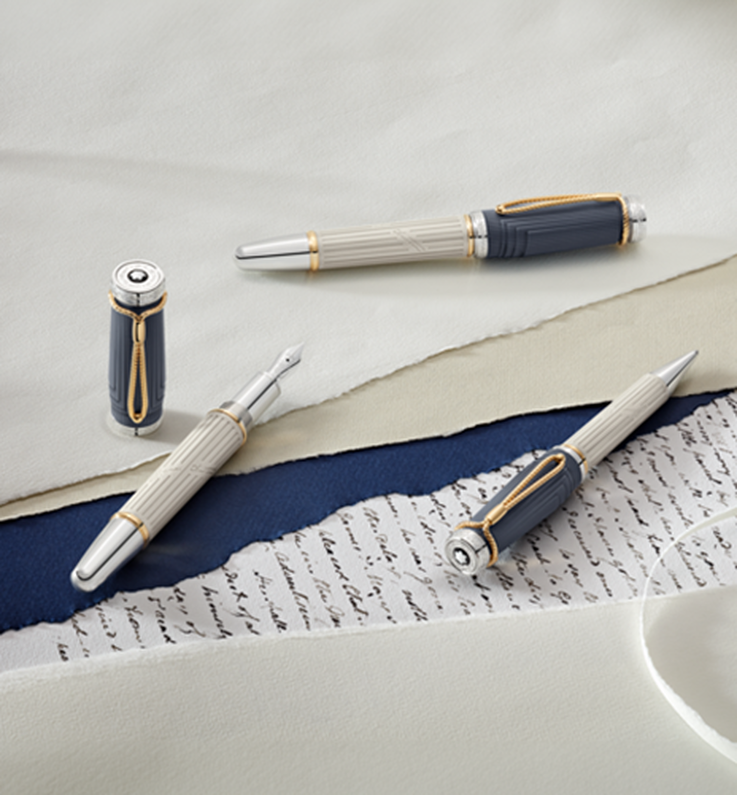 Montblanc pens on a desk.