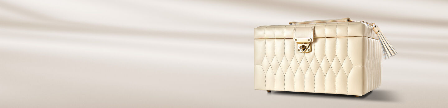 WOLF jewellery box on a beige background.