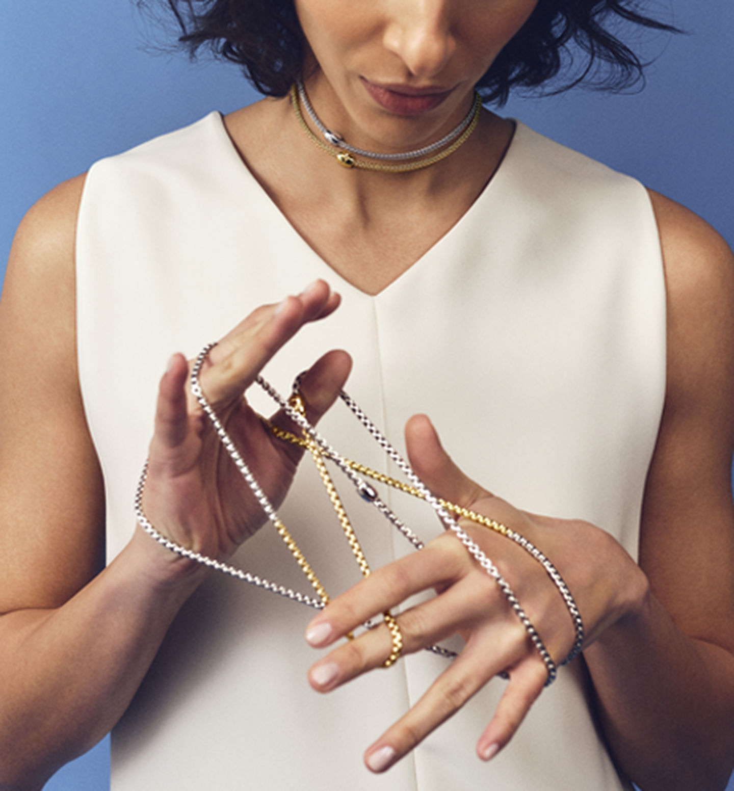 A woman wearing FOPE jewellery.