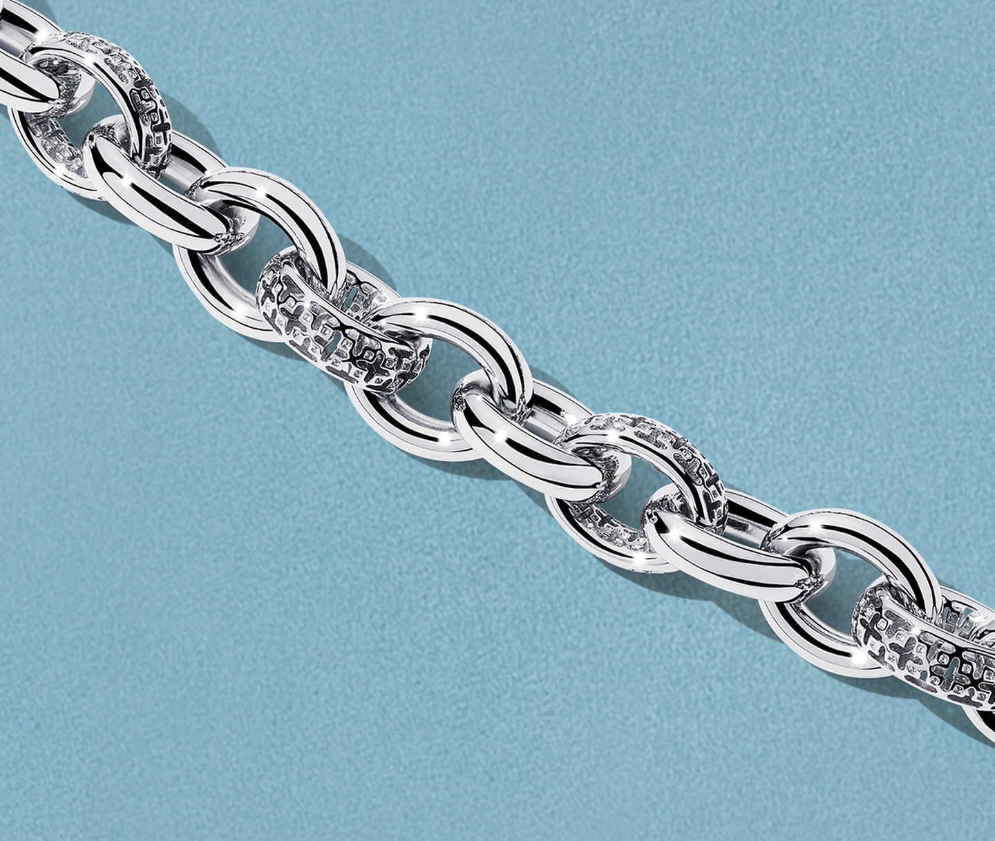 Birks Dare to Dream silver bracelet on a blue background.