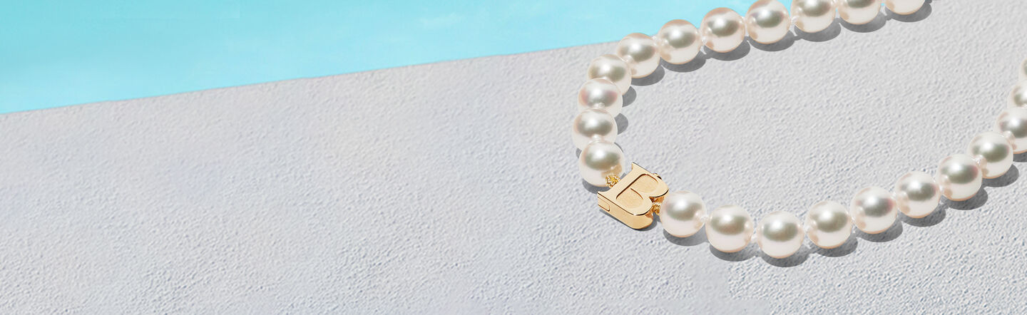 Birks Pebble necklace on a blue backround