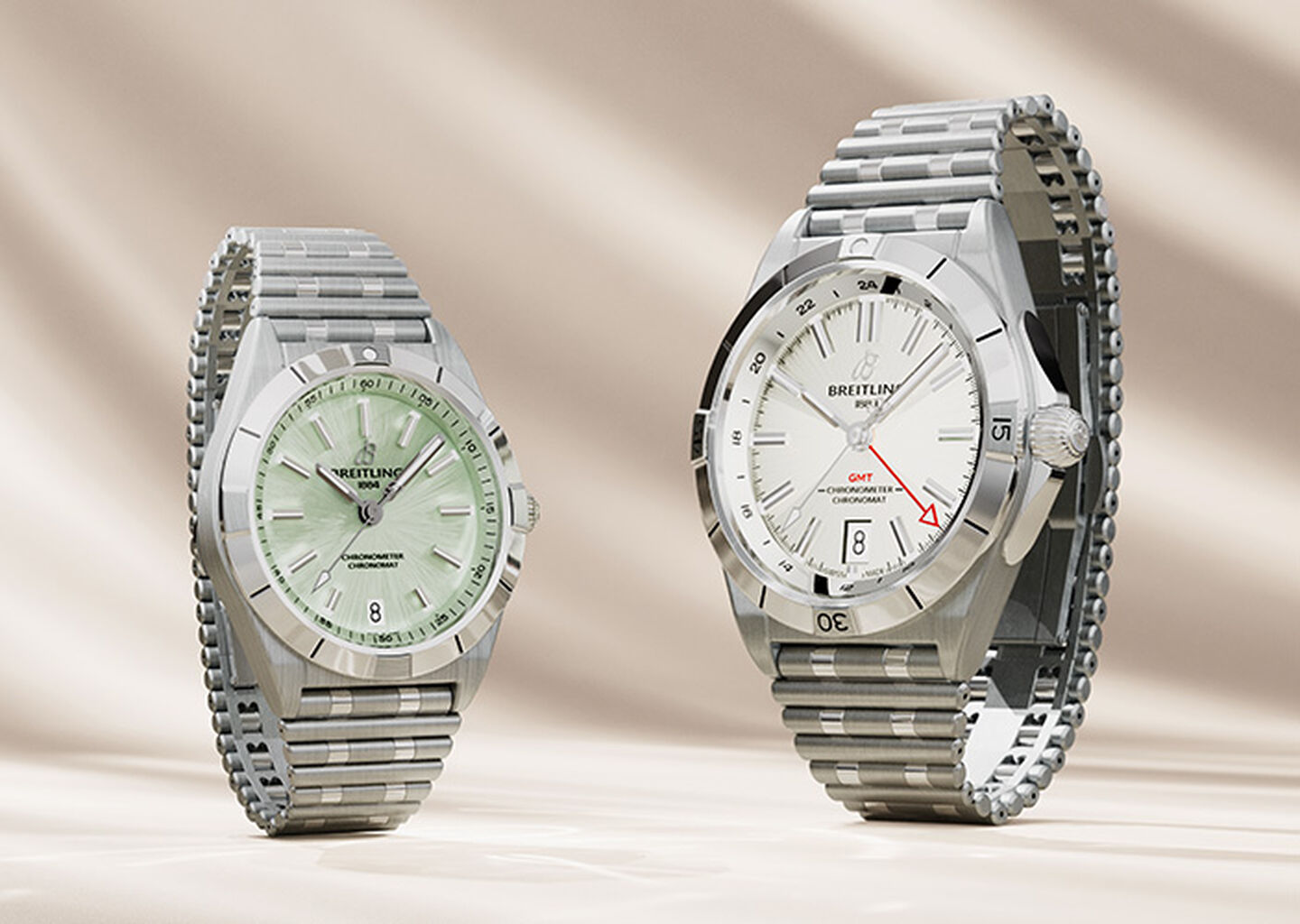 Breitling Chronomat watches on a beige background.