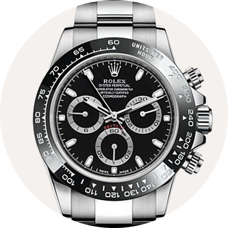 Montre Rolex Cosmograph Daytona sur un fond beige.