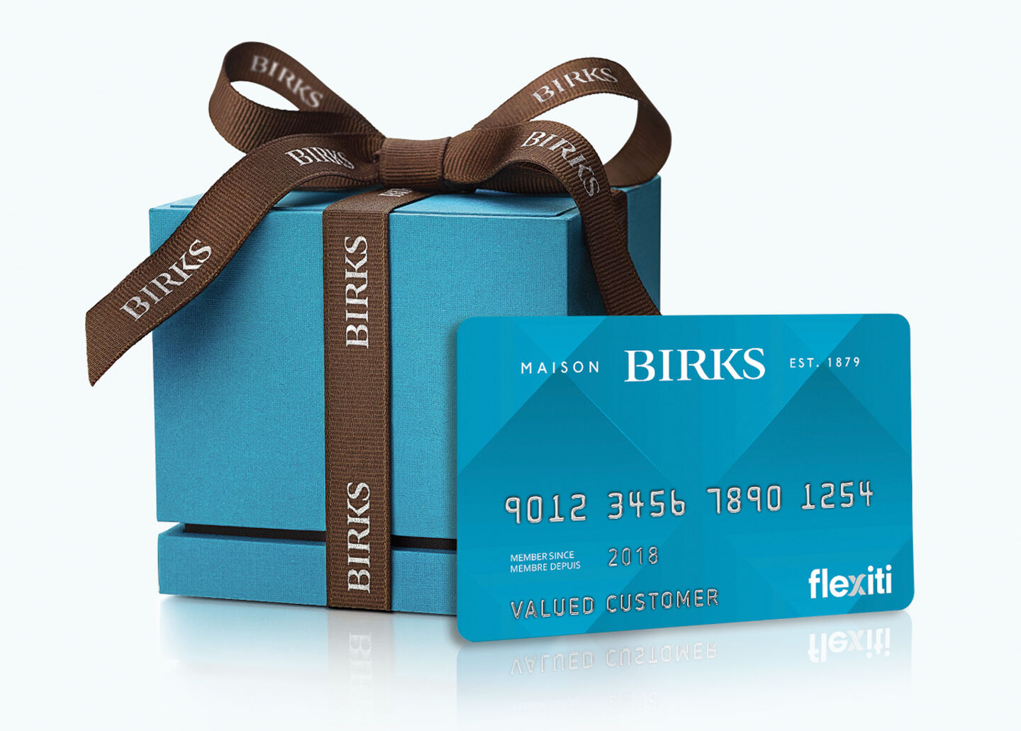 A Birks Blue Box with a Maison Birks Flexiti Card on a blue background.
