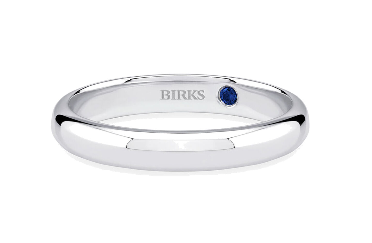 Birks Blue diamond engagement ring and wedding band on a blue background.