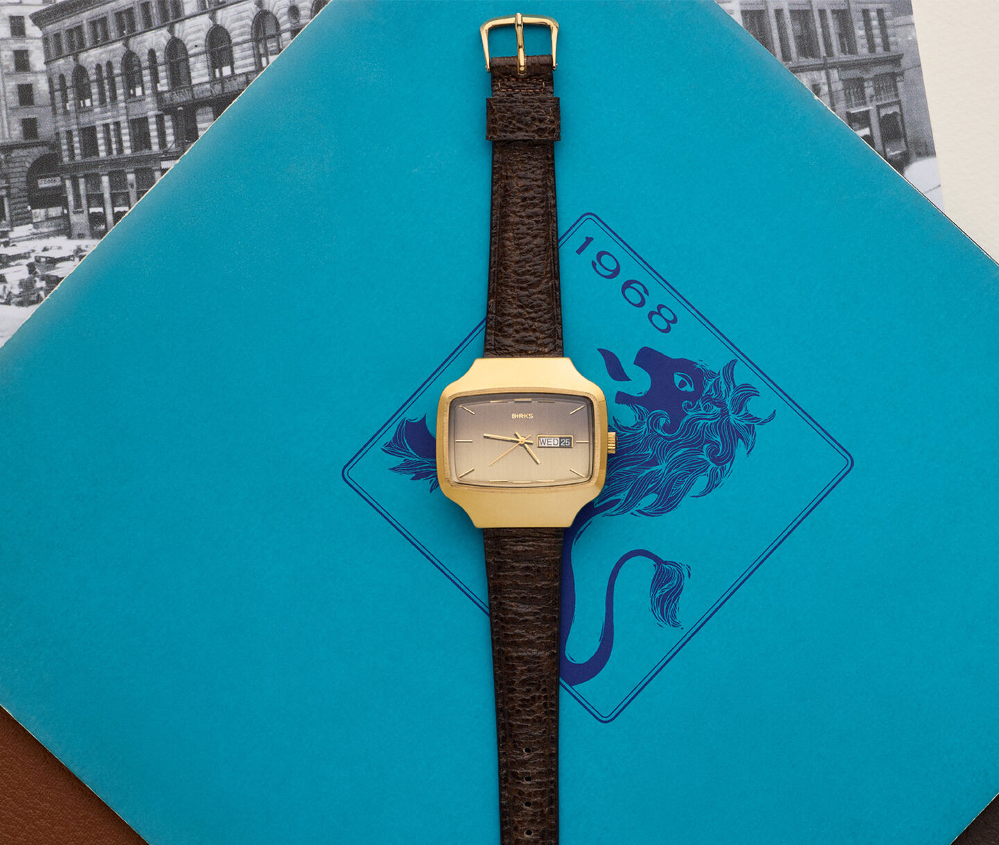 Vintage Birks wristwatch on archival materials symbolizing family heritage and lasting memories