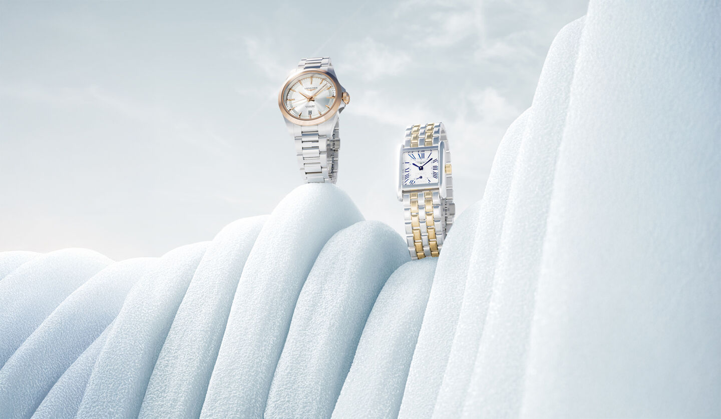 Two Longines watches on a snowy background.