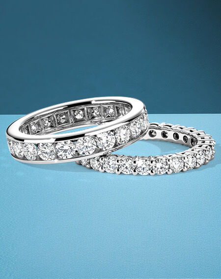 Birks diamond eternity bands on a blue background.