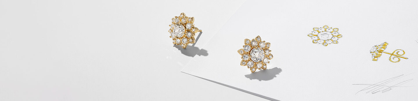 A design of a Maison Birks bespoke diamond and yellow gold earrings.
