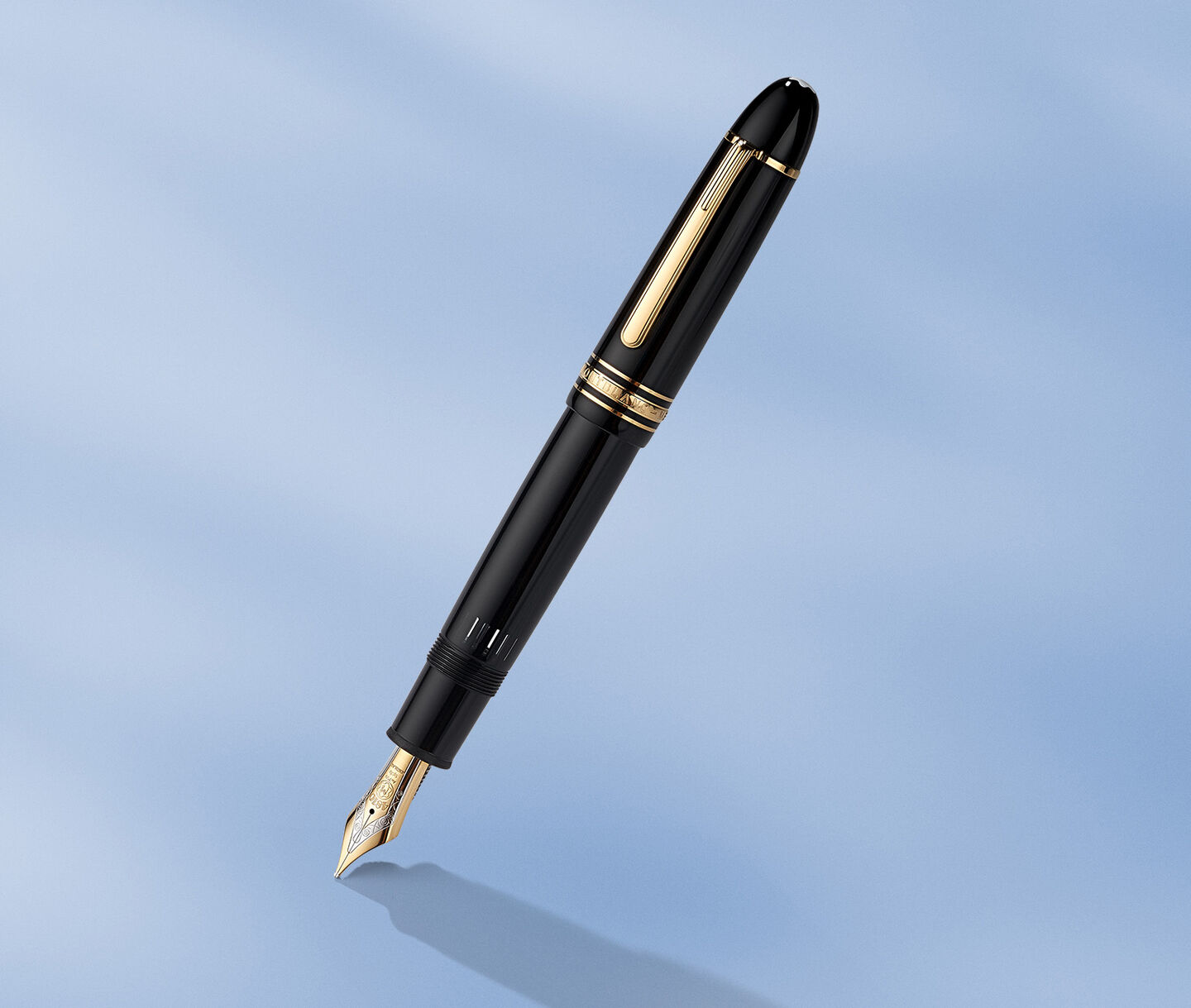 Montblanc fountain pen on a blue background.