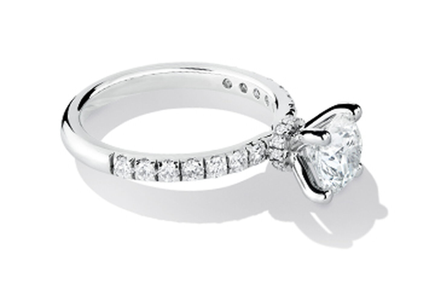 White gold and diamond ring with diamond insets in the band