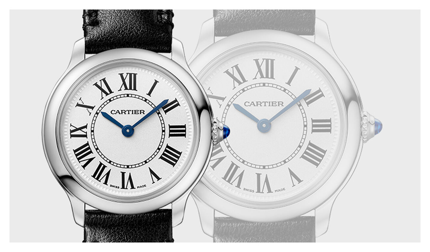 Ronde Must de Cartier watch on a grey background.