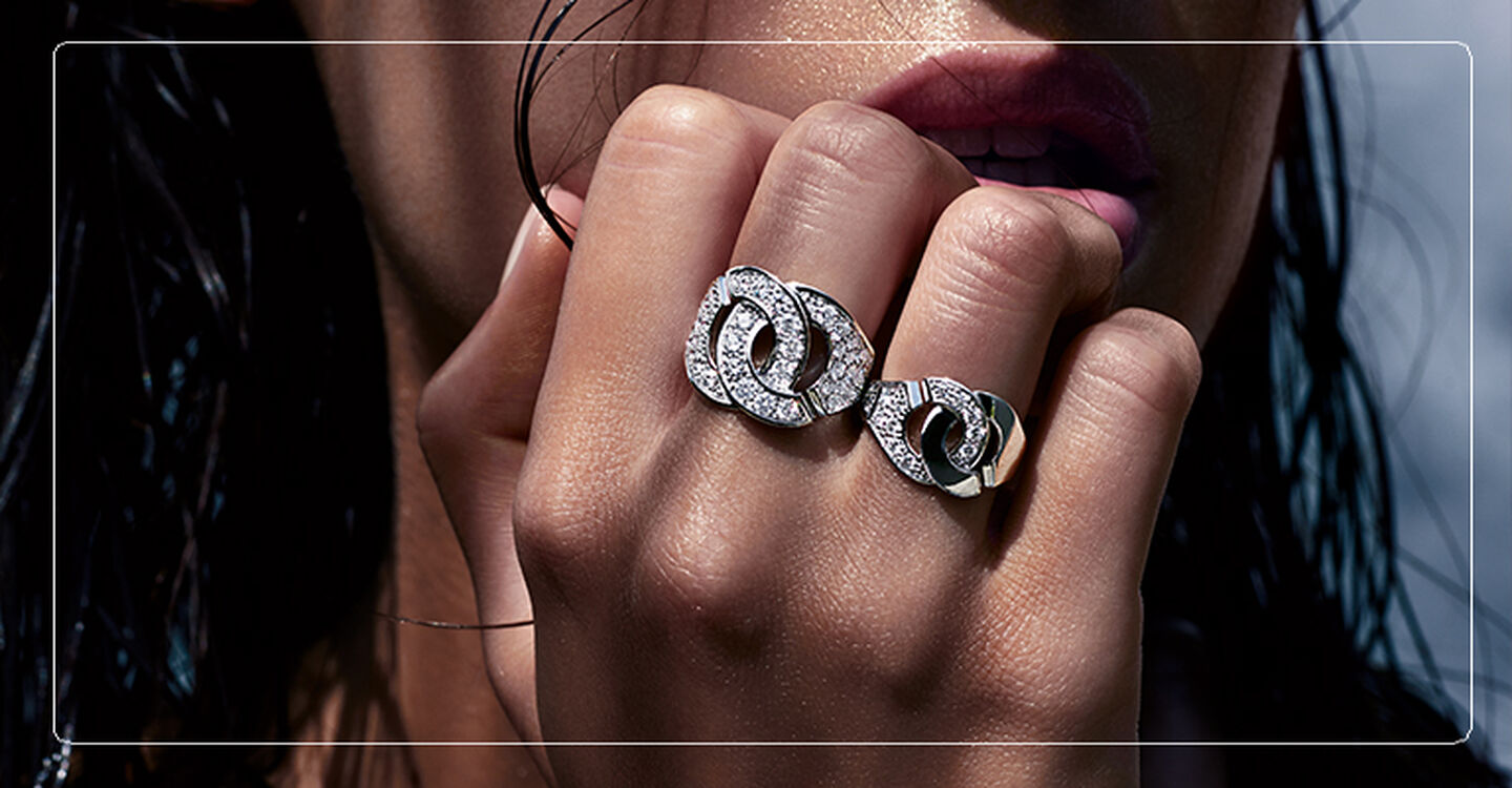 Woman wearing dinh van Menottes diamond rings