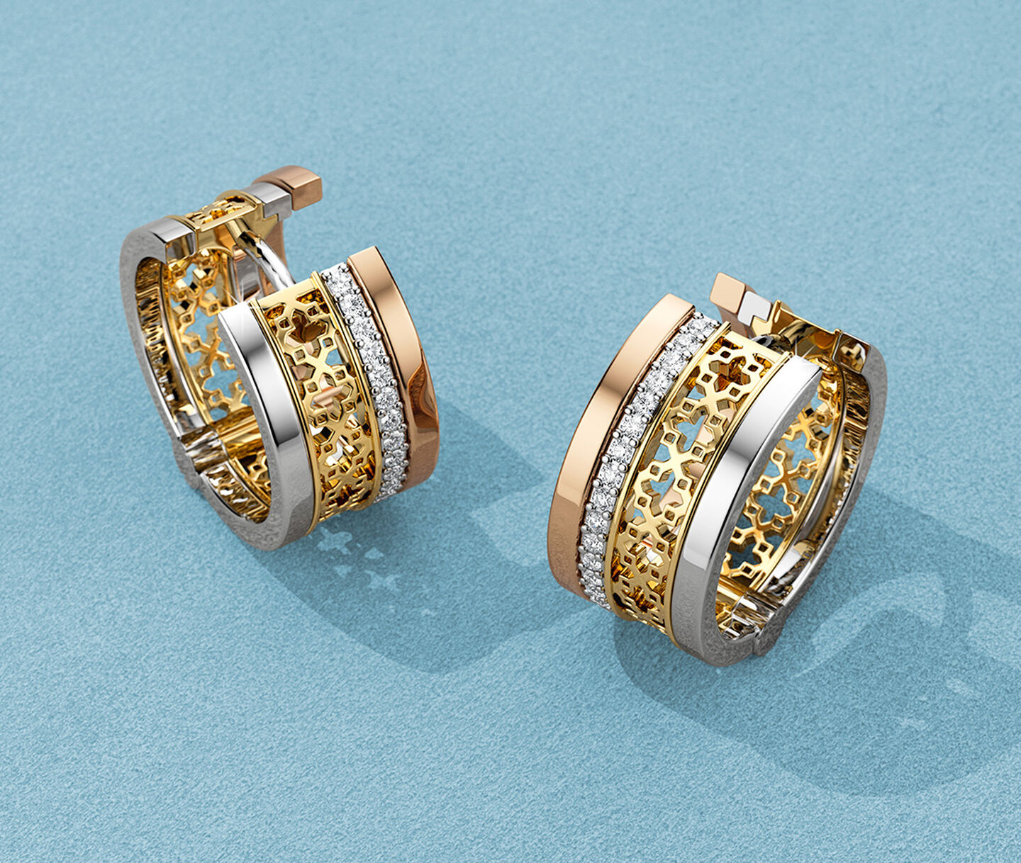 Birks Dare to Dream earrings on a blue background.