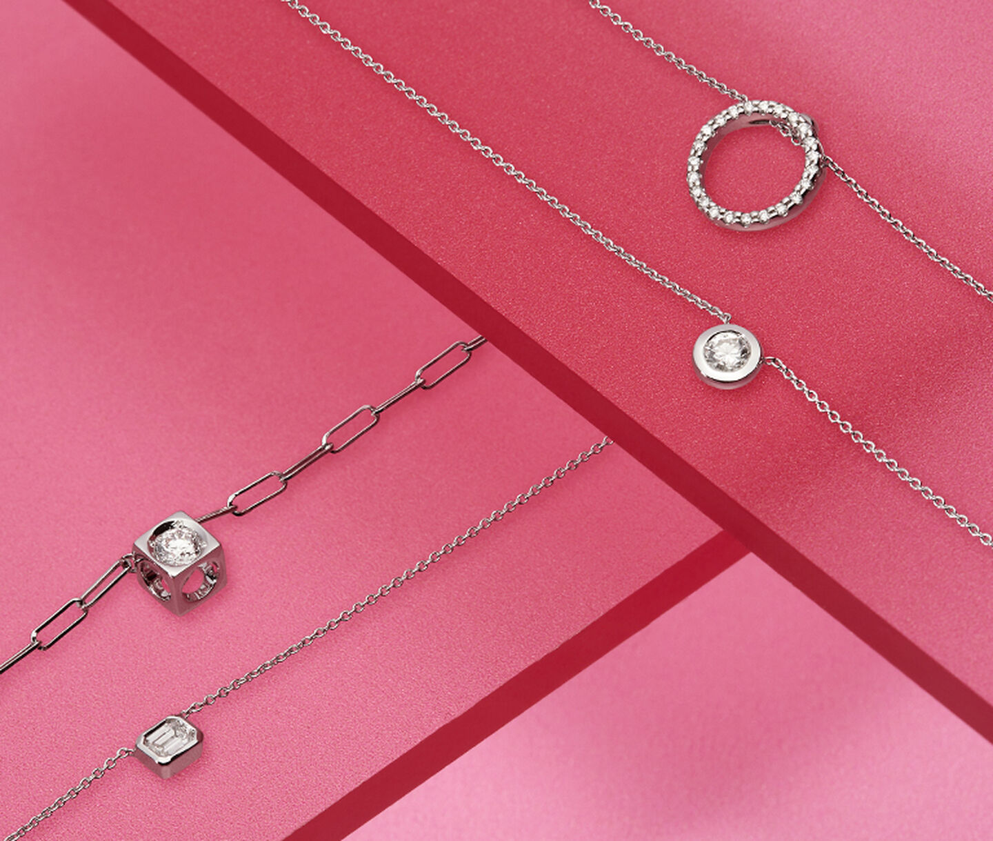 Diamond necklaces and bracelets on a red background