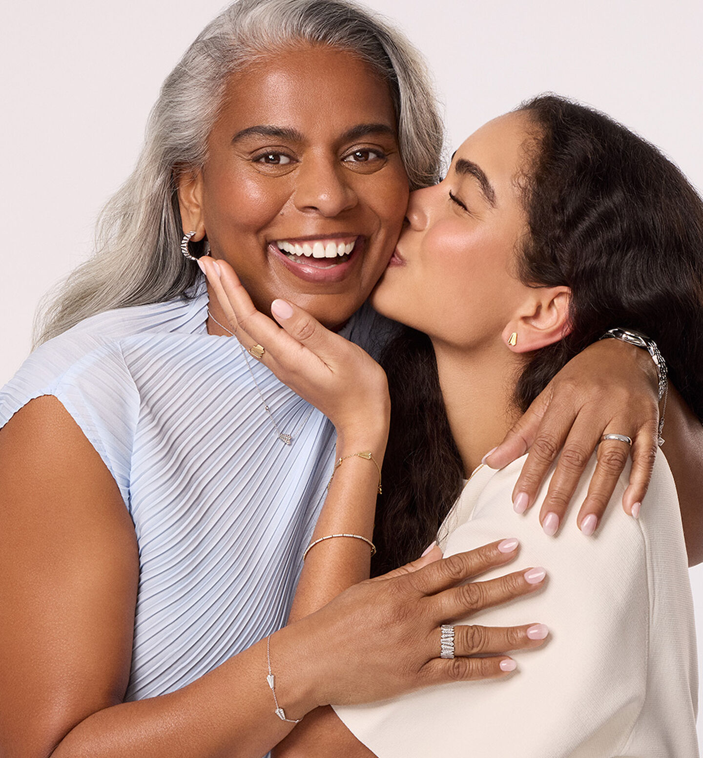 A mother and daughter wearing pieces from Maison Birks.