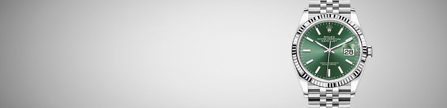 Rolex Datejust watch on grey background