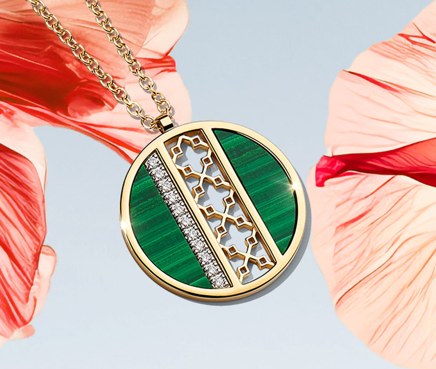 A Birks Dare to Dream malachite diamond medallion on a pink flower over a light sky blue background.