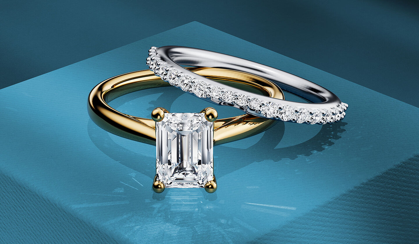 Birks diamond engagement rings on a blue background.