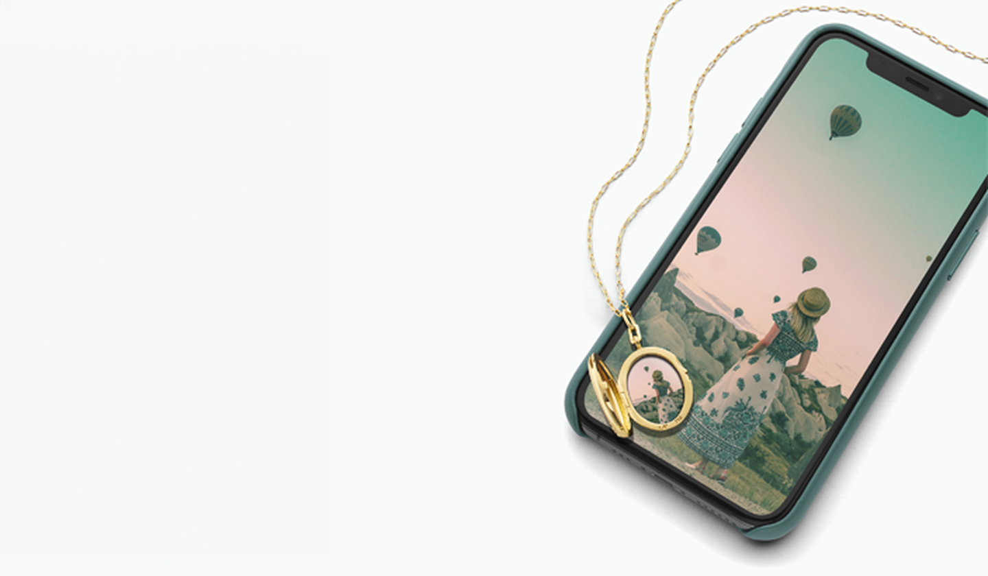 Monica Rich Kosann locket with phone.