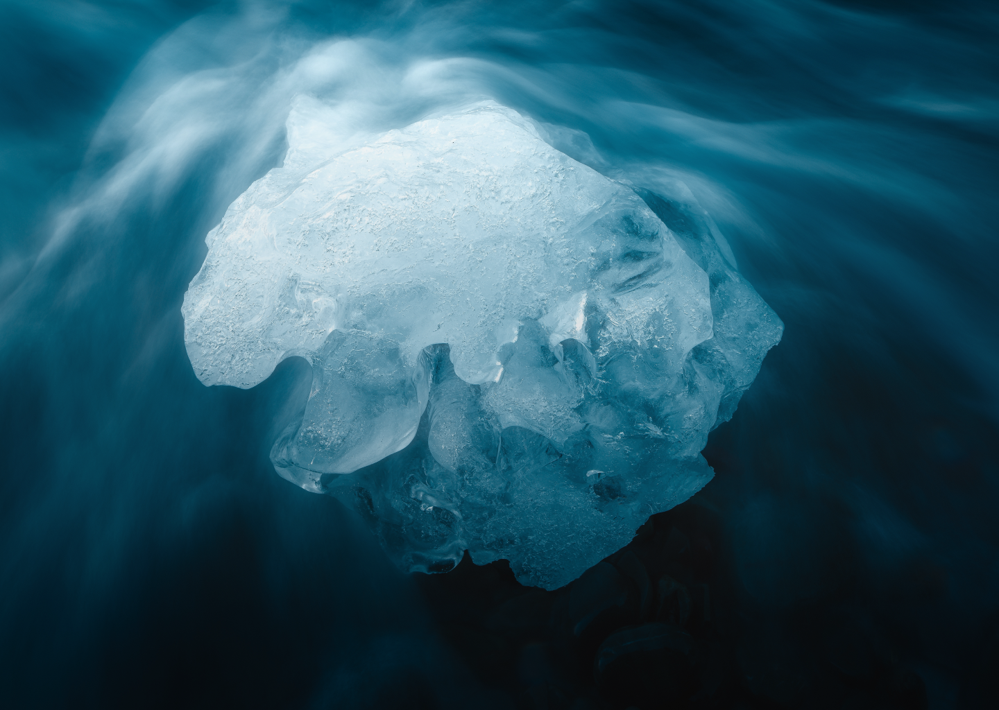 an ice block in the middle of a flowing river.